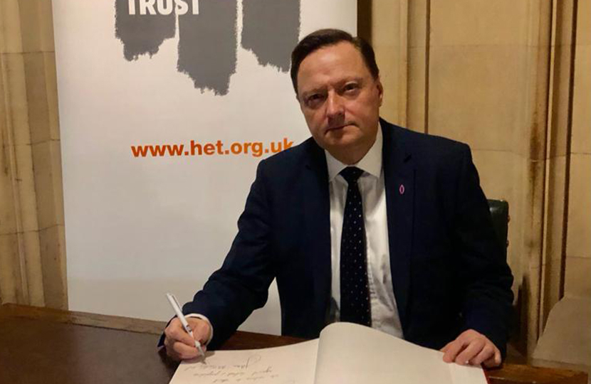 Jason McCartney MP signs the Holocaust Educational Trust memorial book